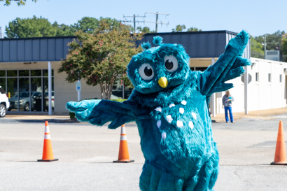 Owl mascot spreading its wings