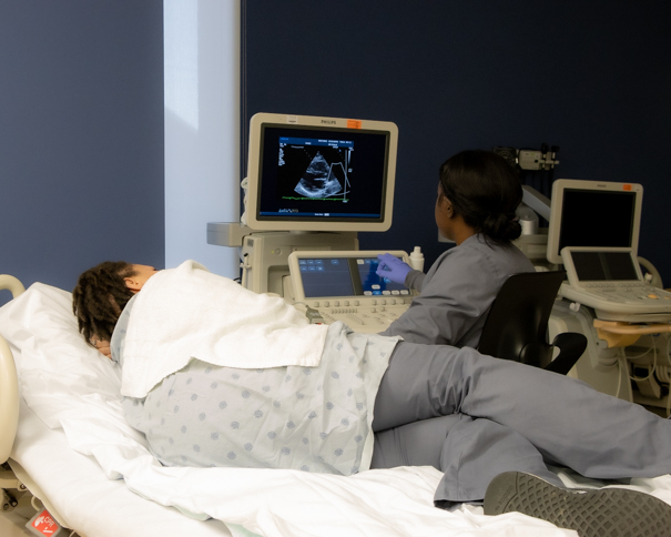 ECHO students using an ultrasound machine 
